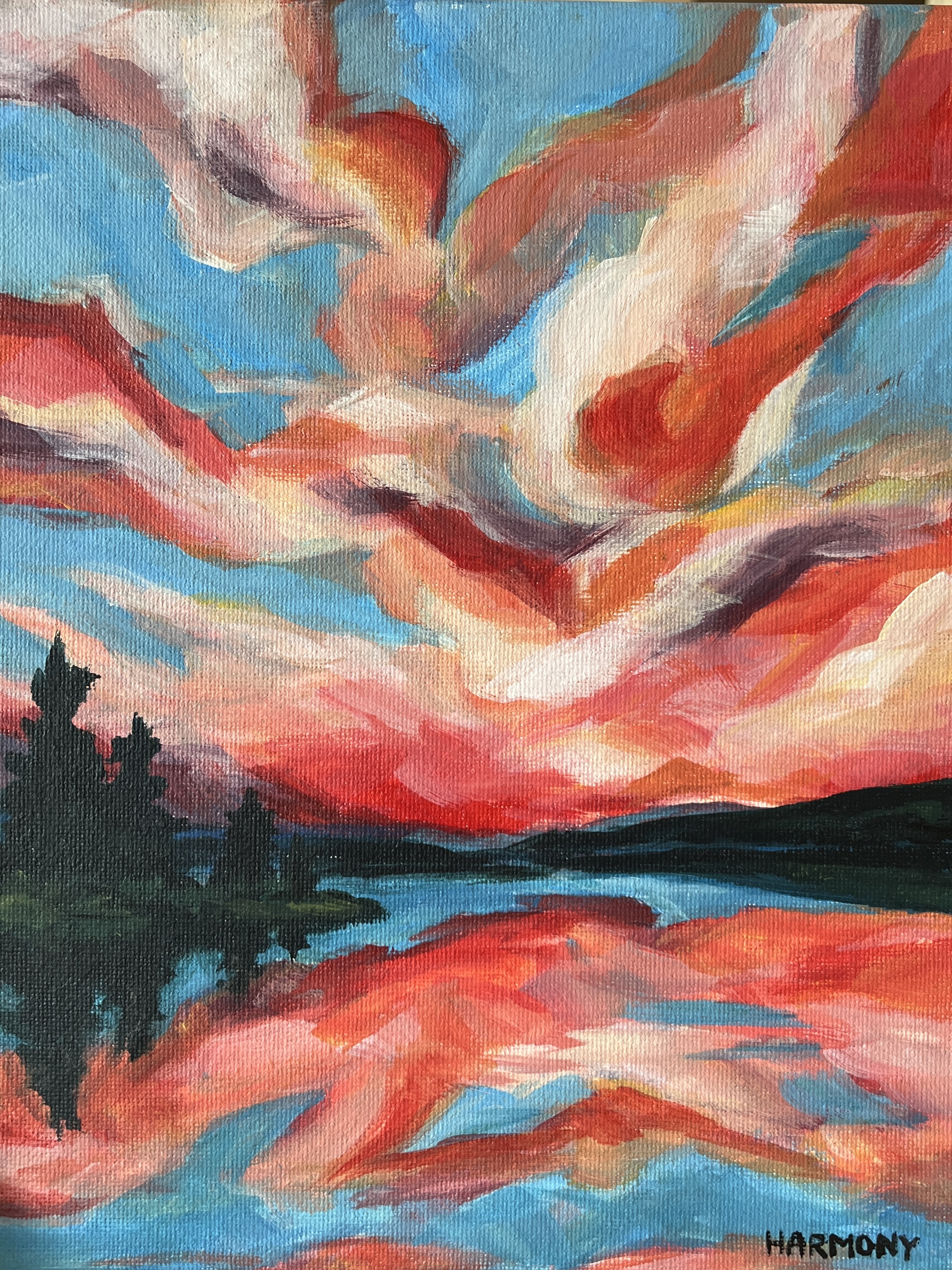 Vibrant red and blue sunset over water